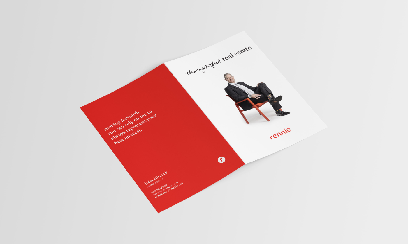 Modern real estate marketing card featuring an agent seated on a red chair, with bold red and white layout.